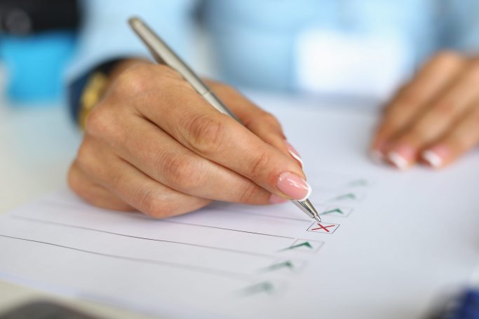 Woman,Fills,Out,Questionnaire,By,Ticking,Document.,Business,Development,Planning