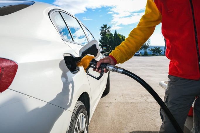 Man,Pumping,Gasoline,Fuel,In,Car,At,Gas,Station,And